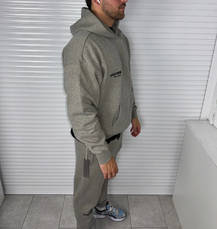 FEAR OF GOD ESSENTIALS DARK HEATHER OATMEAL TRACKSUIT (SS22)
