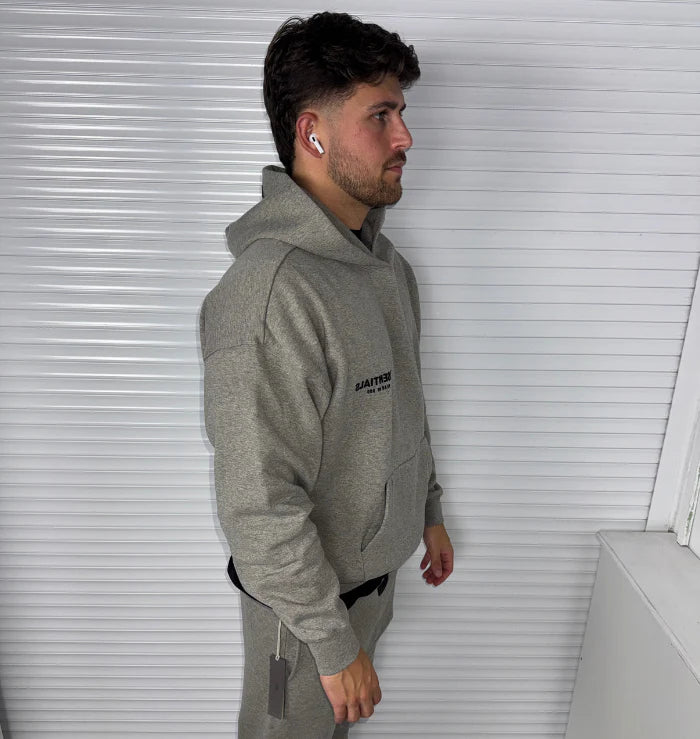 FEAR OF GOD ESSENTIALS DARK HEATHER OATMEAL TRACKSUIT (SS22)
