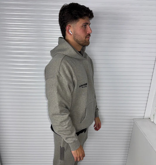 FEAR OF GOD ESSENTIALS DARK HEATHER OATMEAL TRACKSUIT (SS22)